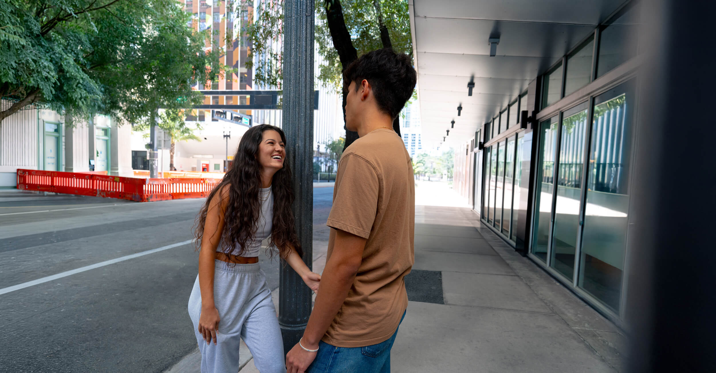 Young woman talking to young man